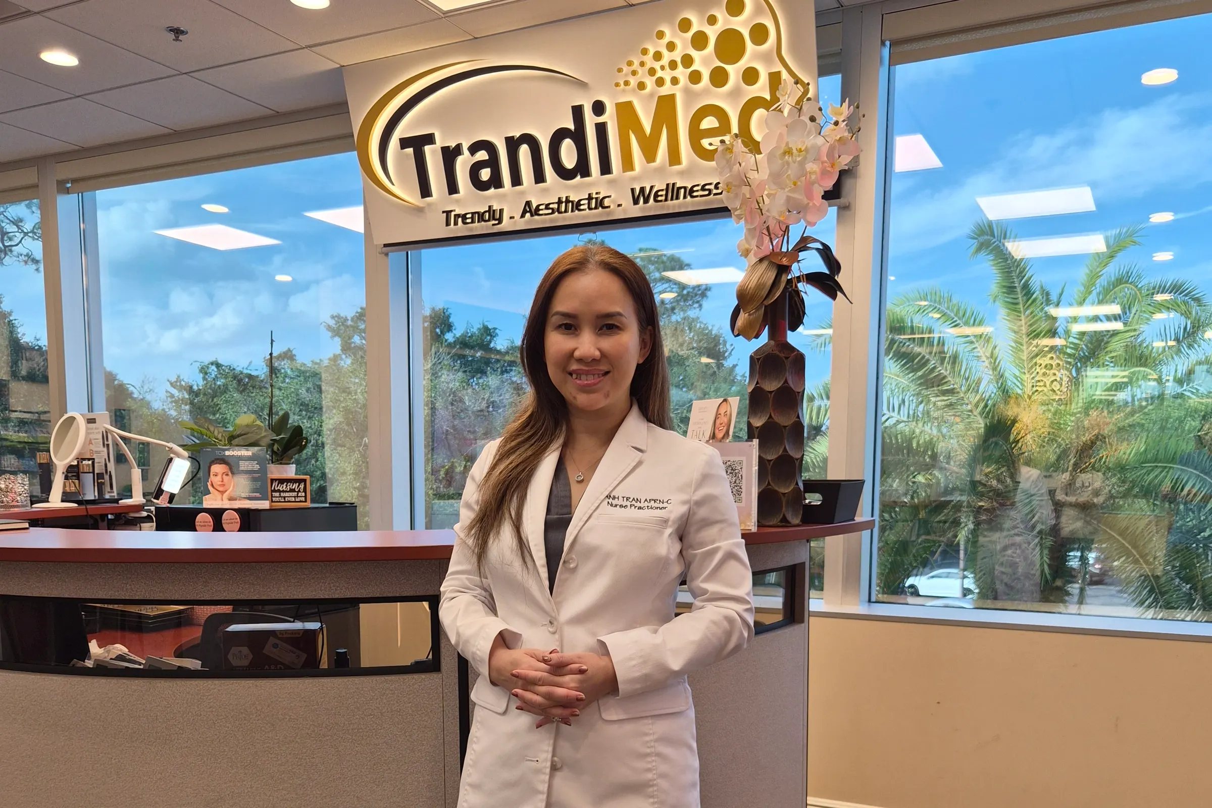 Nurse Trandi at the reception desk of Trandi Med Spa in Oviedo
